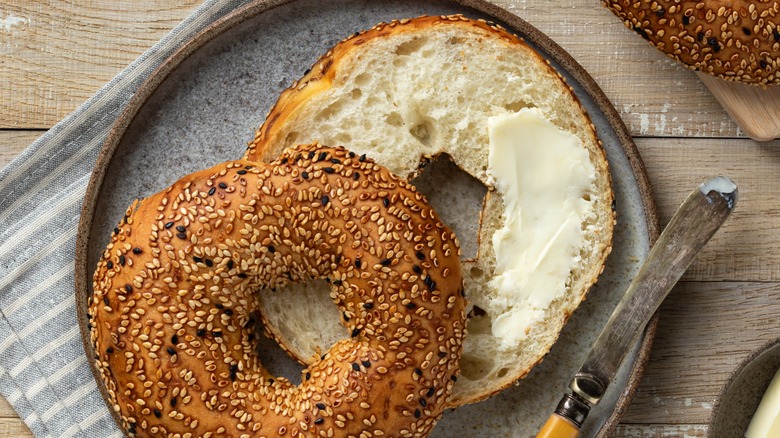 Bagel with honey butter on plate