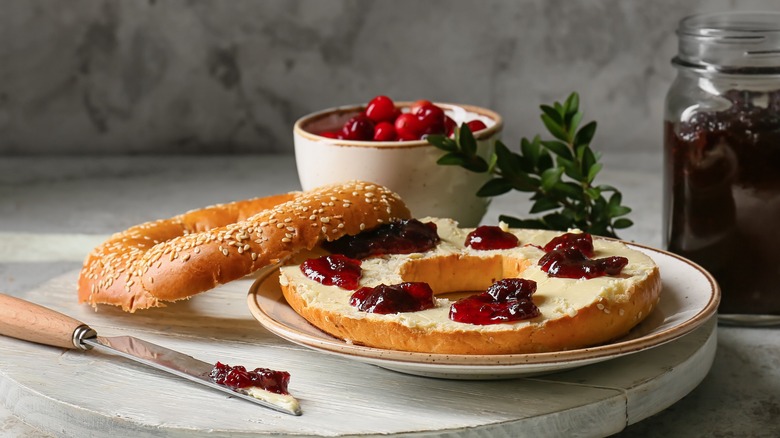 Bagel with butter and jam on lazy susan