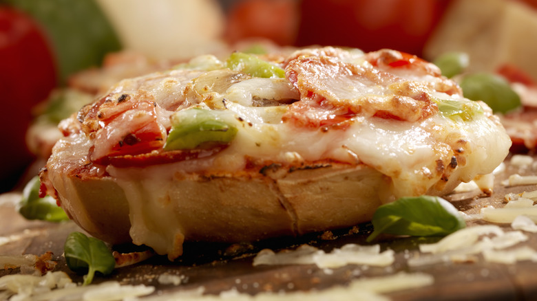 Pizza bagel with toppings close up