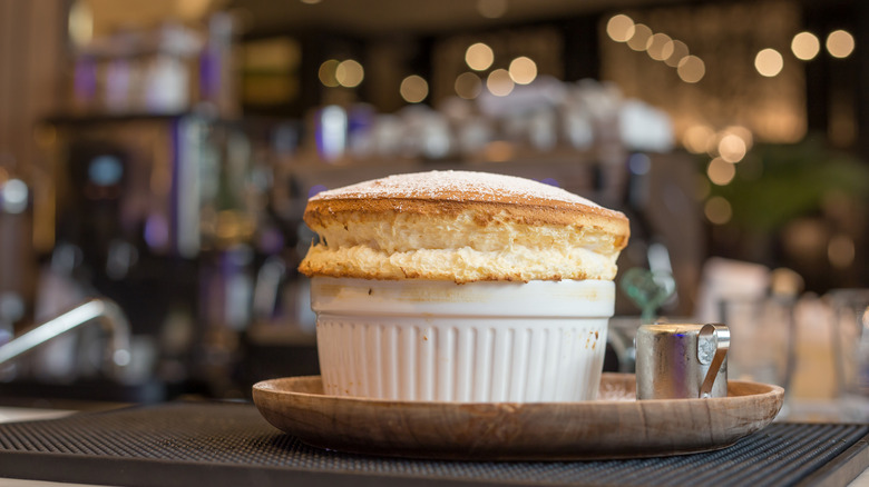 Freshly baked soufflé in white ramekin