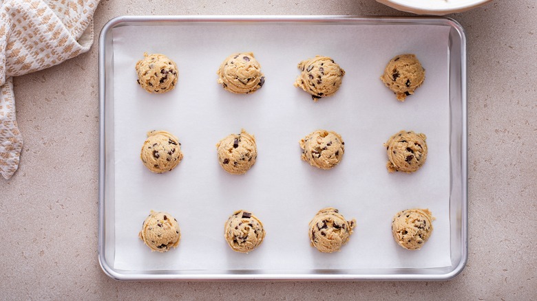 Cookie dough scooped on baking sheet to be put in fridge