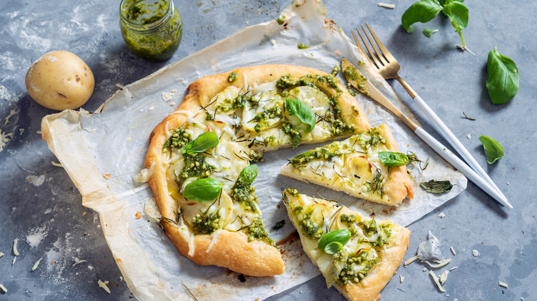 pesto pizza on gray background