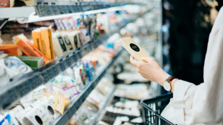 woman shopping for cheese