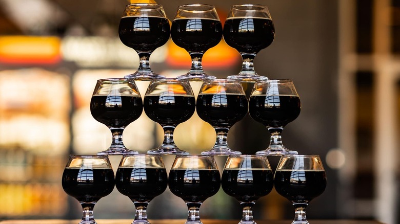 Stacked beer glasses full of stout