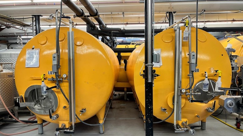 Two yellow Dovetail Brewery beer tanks