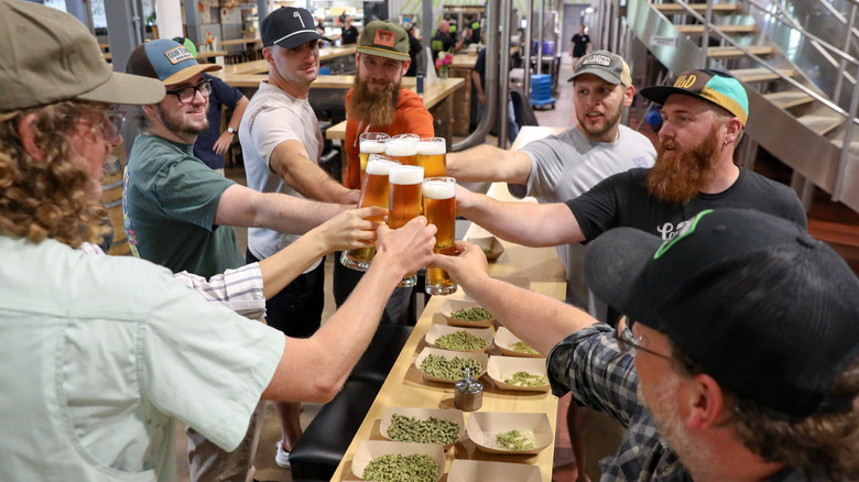 People smiling on a brewery tour