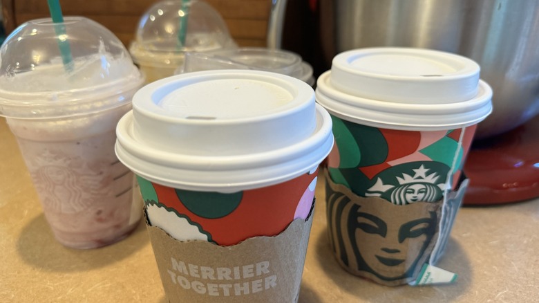 An assortment of Starbucks drinks on a kitchen counter