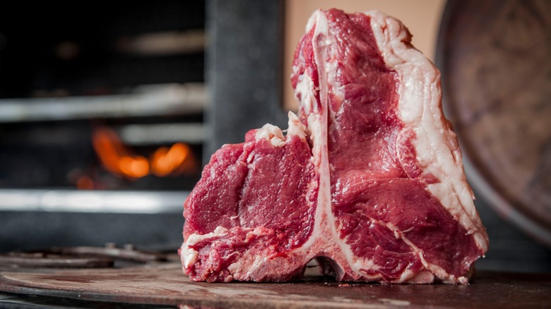 Raw T-bone on a cutting board