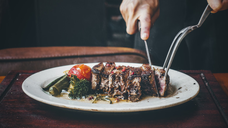 Steak being cut into strips