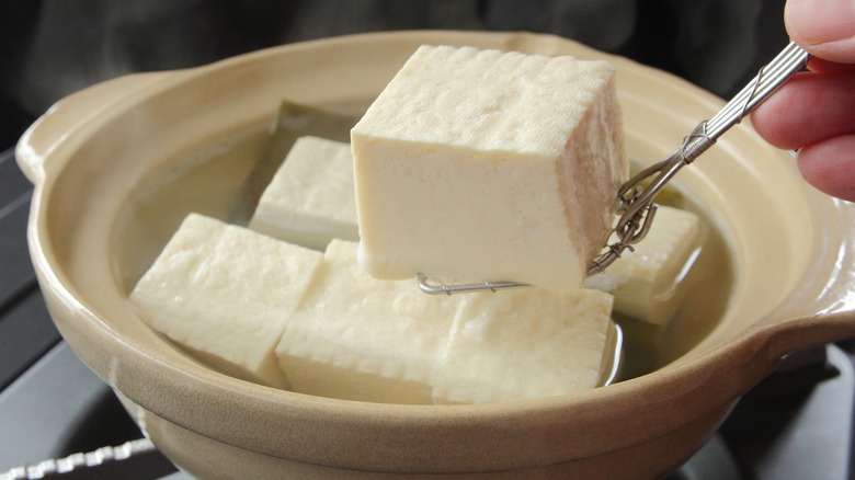 Square cuts of tofu in a bowl