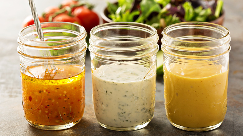 Three jars of salad dressing