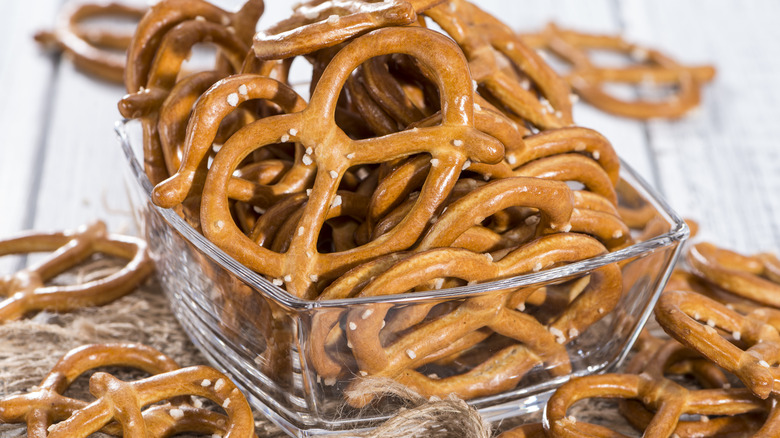 A glass bowl of hard pretzels