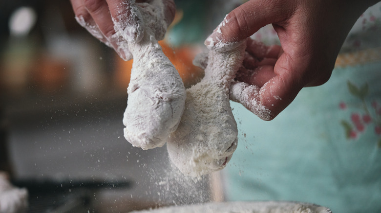 Chicken drumsticks dredged in flour