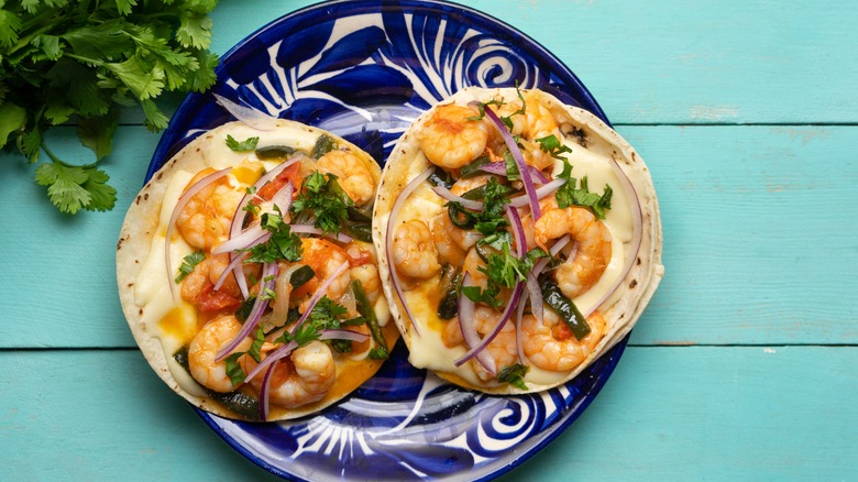 Two tacos gobernador with shrimp and cheese