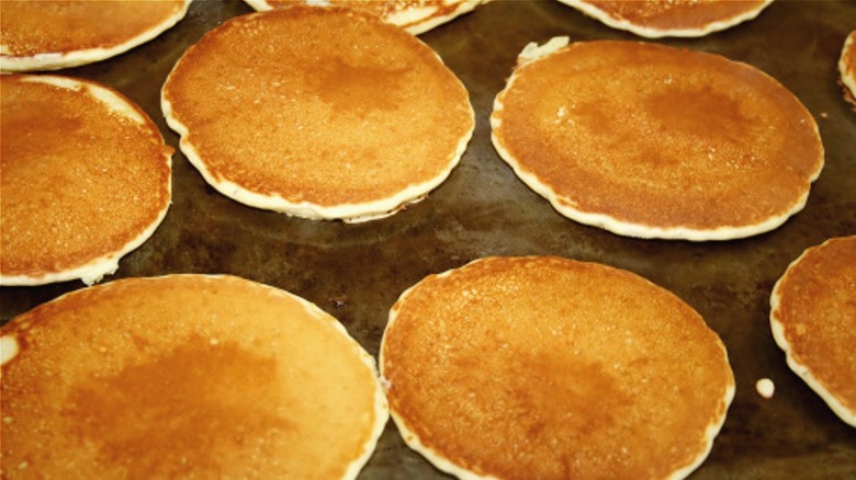 several pancakes on griddle