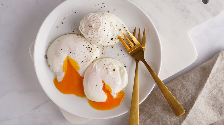 plate of three poached eggs