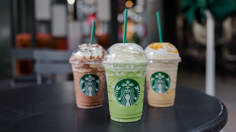 three Starbucks drinks on table