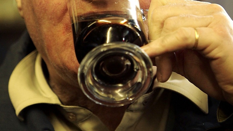 Man enjoys dandelion and burdock beverages.