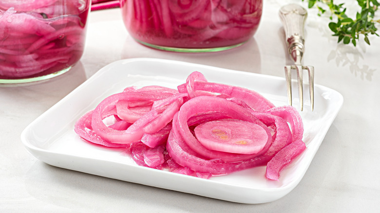 Jar and plate of pickled red onions