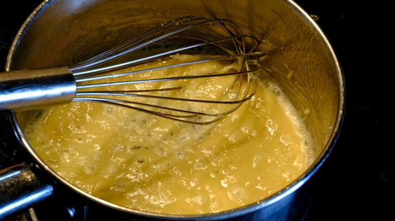 roux in bowl with whisk