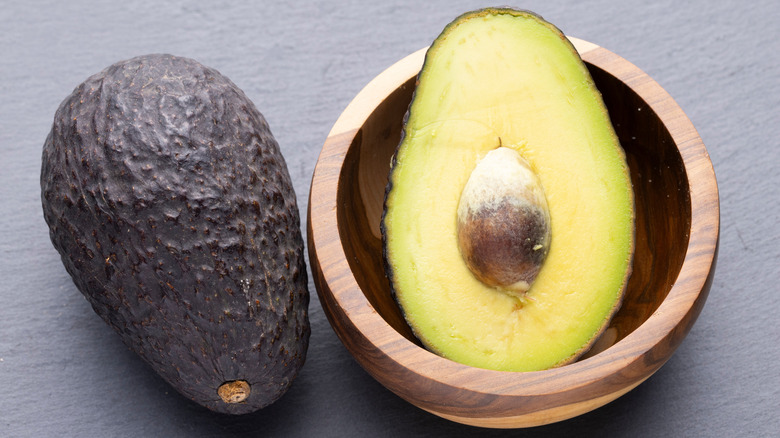 halved avocado in a bowl