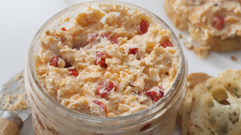 jar of pimento cheese with crostini