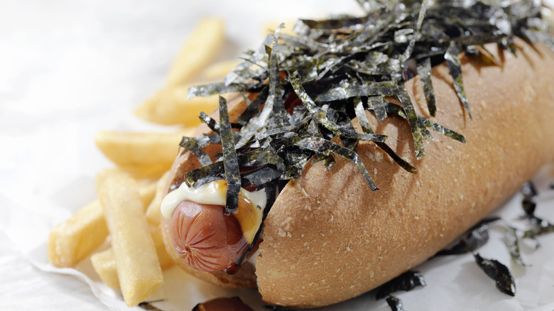 A Japanese hot dog topped with nori