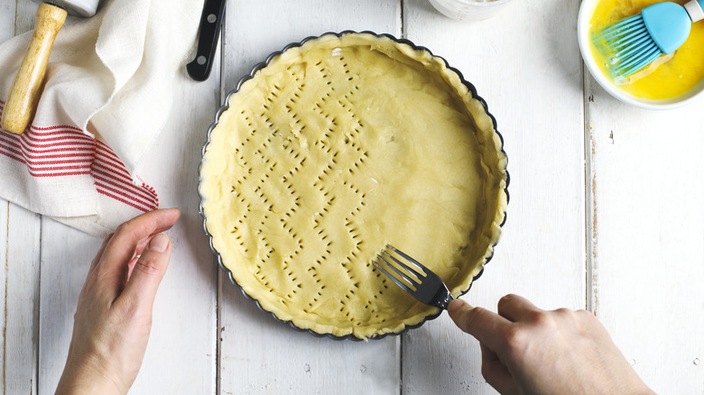 Person making pie crust