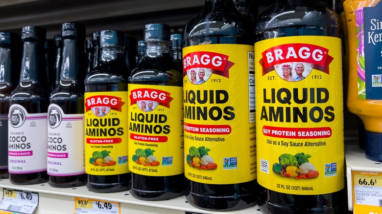 Bottles of liquid aminos on a grocery store shelf