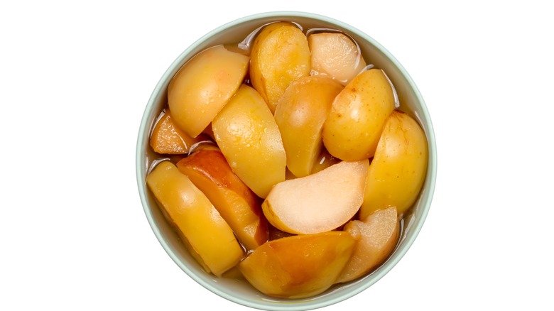 Canned apple slices in bowl