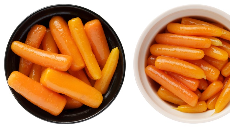 Two bowls of canned carrots