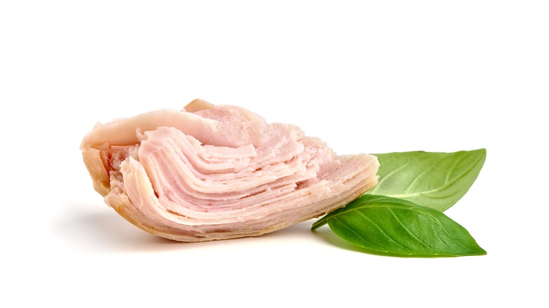 Canned chicken and basil leaf