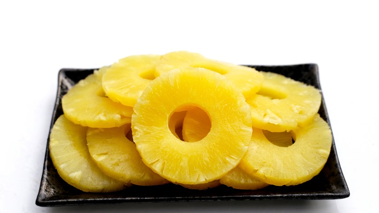 Canned pineapple rings on plate