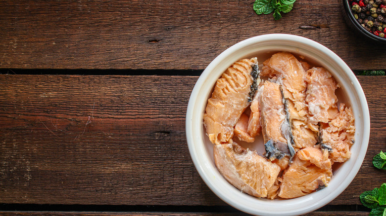 Canned salmon in white bowl 