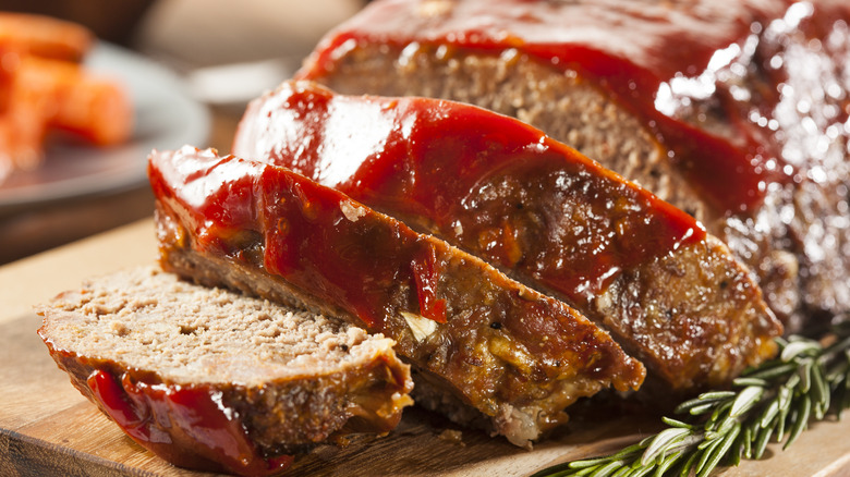 Sliced meatloaf topped with ketchup