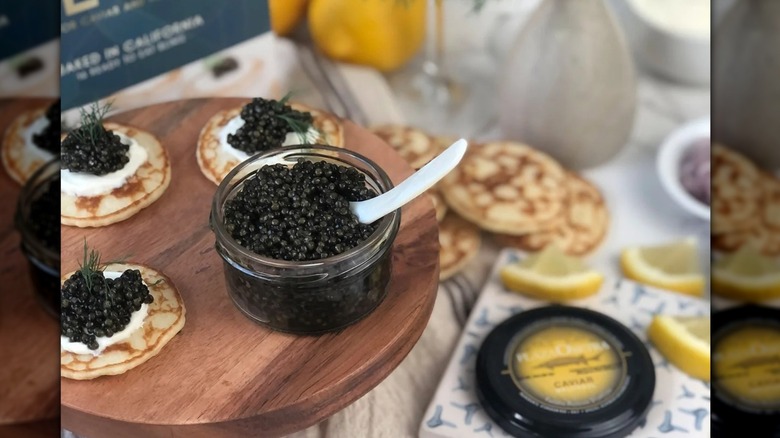 A glass container of caviar