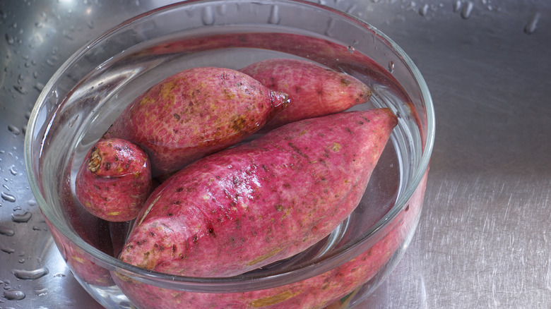 Sweet potatoes soaking in water