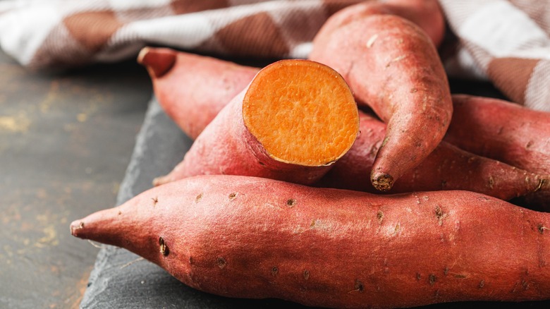 A bunch of raw sweet potatoes