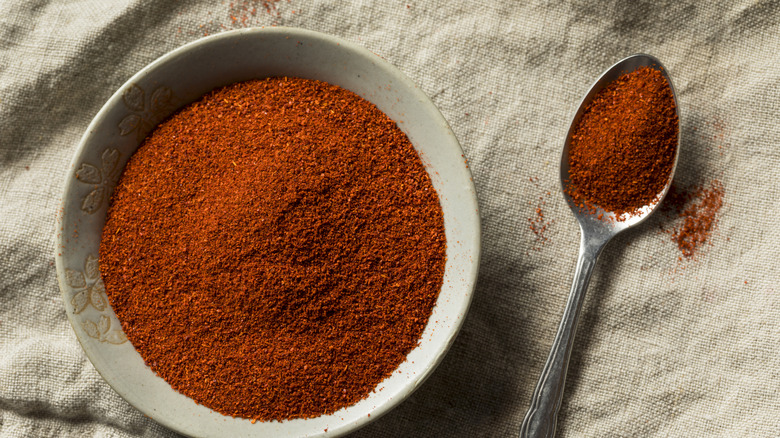 Smoked paprika in a bowl with a spoon