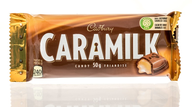Caramilk chocolate bar on white background