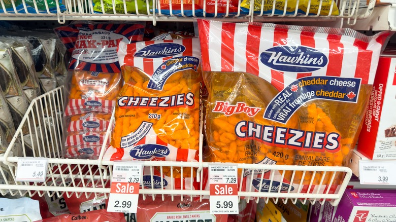Cheezies bag on grocery aisle shelves