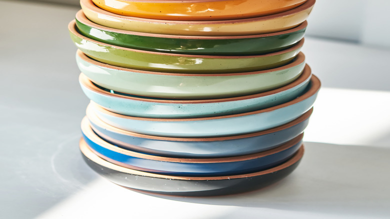 brightly colored stack of shallow ceramic bowls