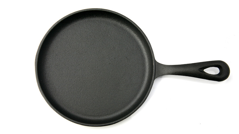 cast iron frying pan from above on white background
