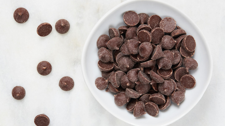 chocolate chips in white bowl