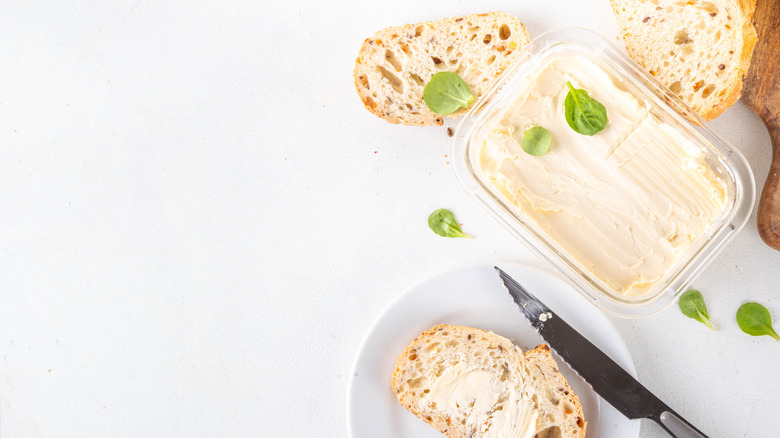 vegan butter in container on white background