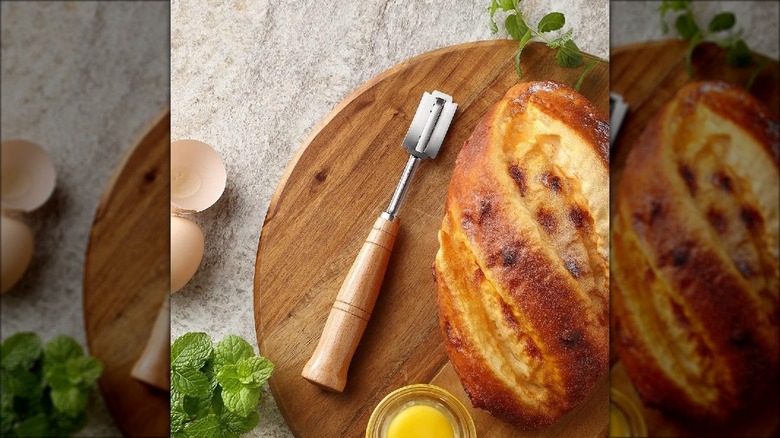 Bread lame knife and sourdough loaf