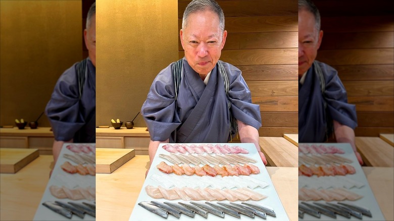 Chef presenting food at Sushi Ichumura