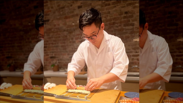 Chef creating fresh sushi at Sushi Ikumi