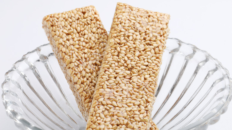 honey and sesame seed crackers in crystal bowl