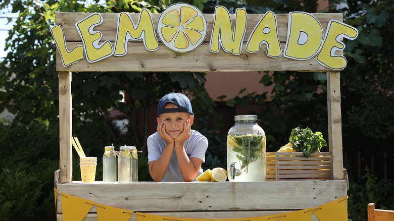 little boy at lemonade stand